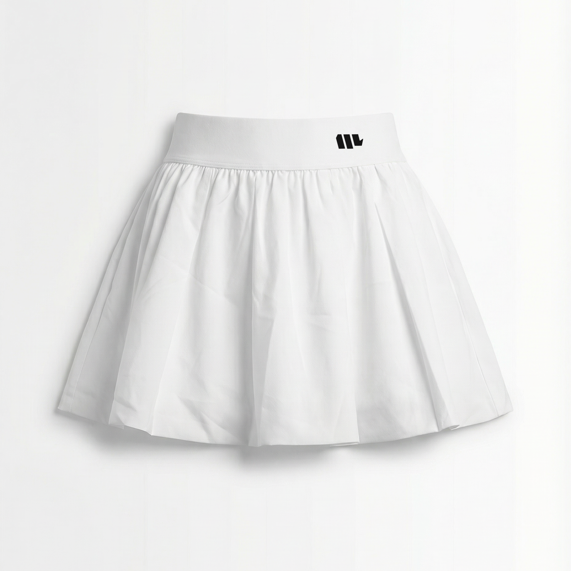 White tennis skirt with black waistband and logo on a white background